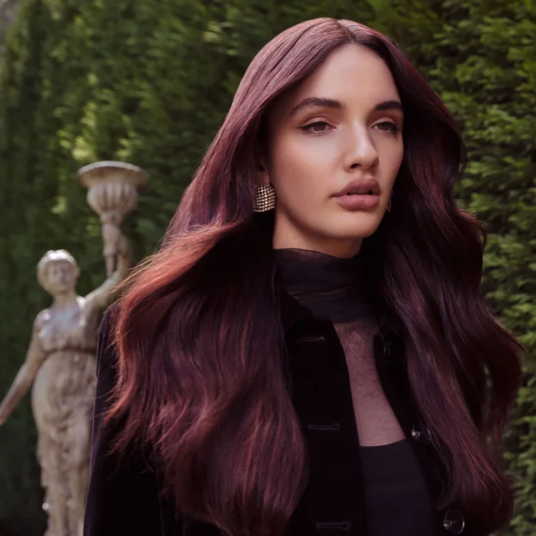 Model with long, glossy burgundy-red hair