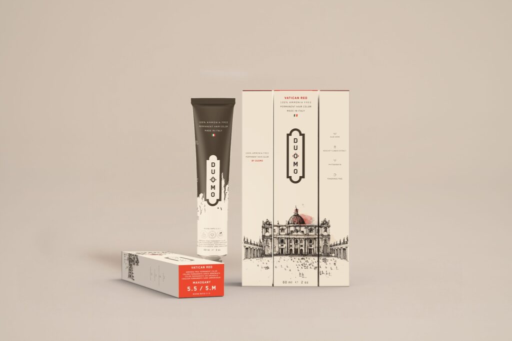 Duomo 5.5 / 5M - Vatican Red Mahogany hair color tube and boxes on a beige backdrop