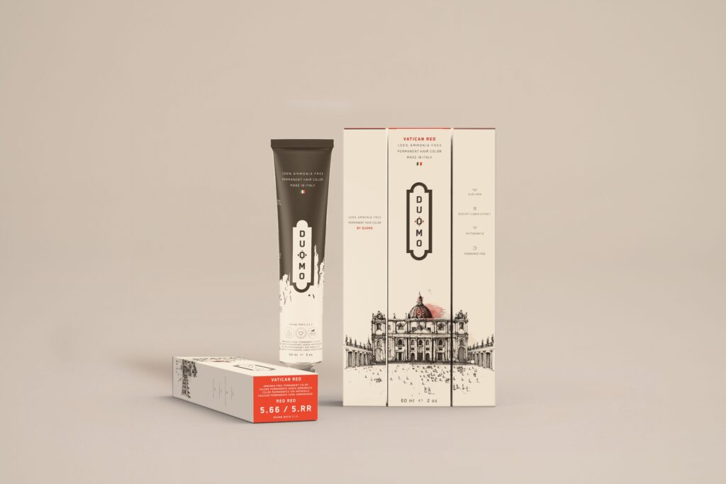 Duomo 5.66 / 5RR - Vatican Red Red Red hair color tube and boxes on a beige backdrop