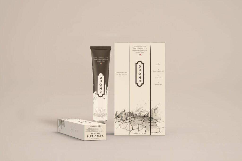 Duomo 9.21 / 9VA - Vesuvius Ash - Violet Ash hair color tube and boxes on a beige backdrop