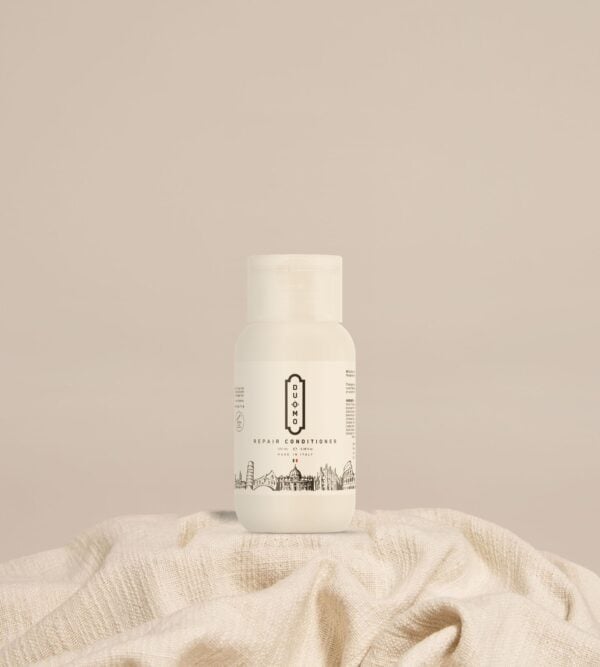 Duomo Repair Conditioner 100 mL on natural linen cloth