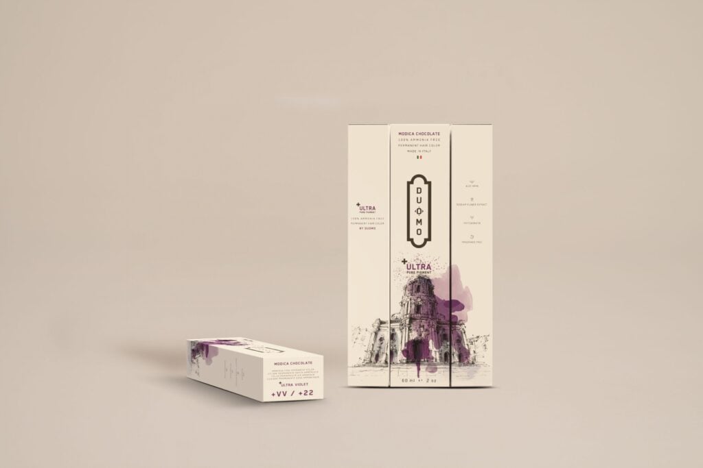 Duomo VV+ Ultra Violet hair color tube and boxes on a beige backdrop