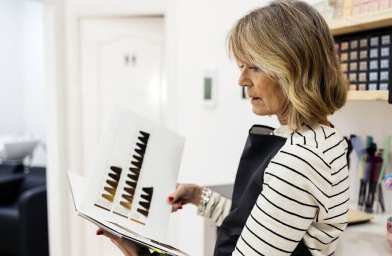 salon owner evaluates a professional hair color line using a shade chart